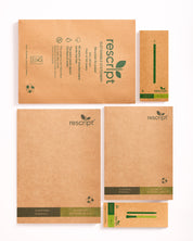 Collection of rescript notebooks and stationery items on a white background