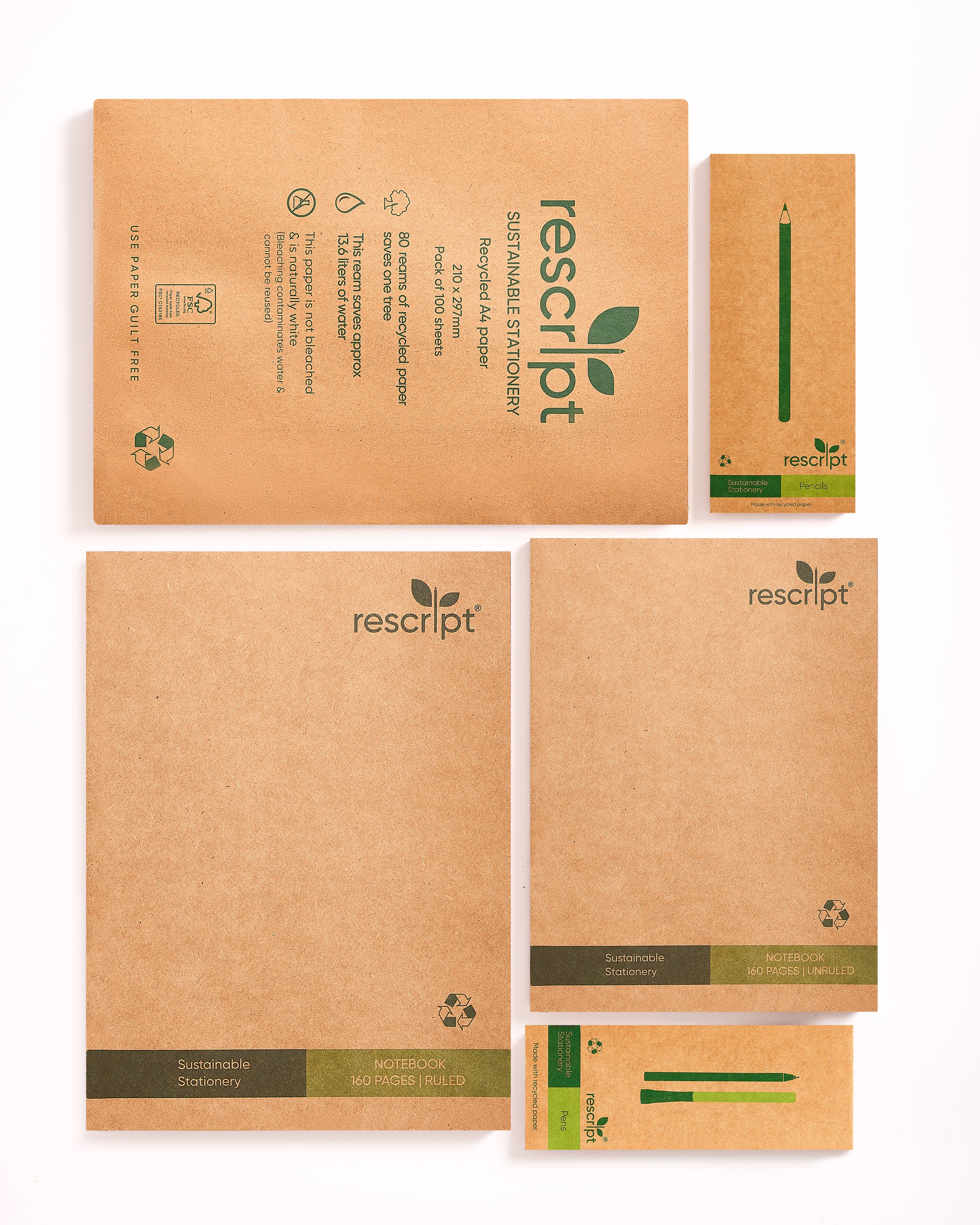 Collection of rescript notebooks and stationery items on a white background