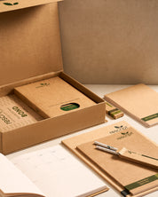 Kraft paper notebooks and stationery set with 'rescued' branding on a neutral background