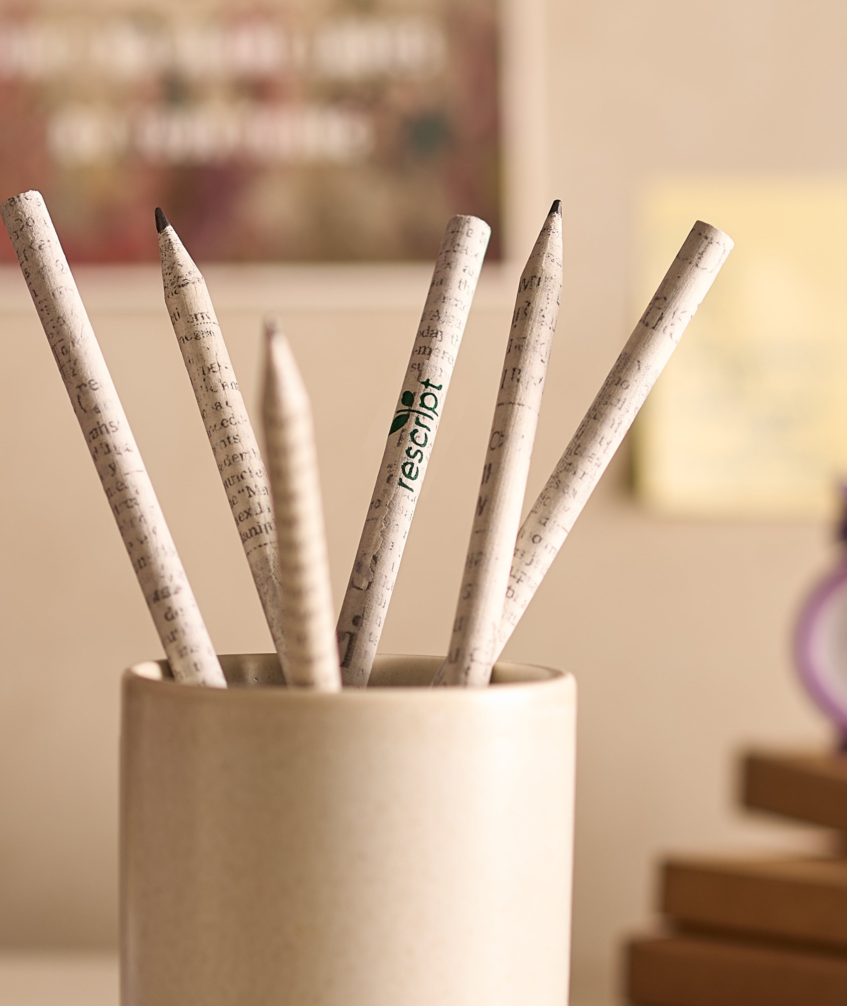 Set of pencils with music note design in a holder on a blurred background