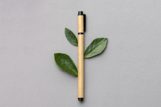 Recycled Paper Pen with a leaf in the Background to represent sustainability