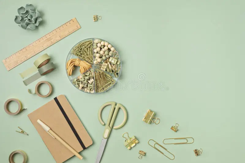 Flat-lay of recycled office supplies—eco-friendly pens, notebooks, and paper products for sustainable stationery guide