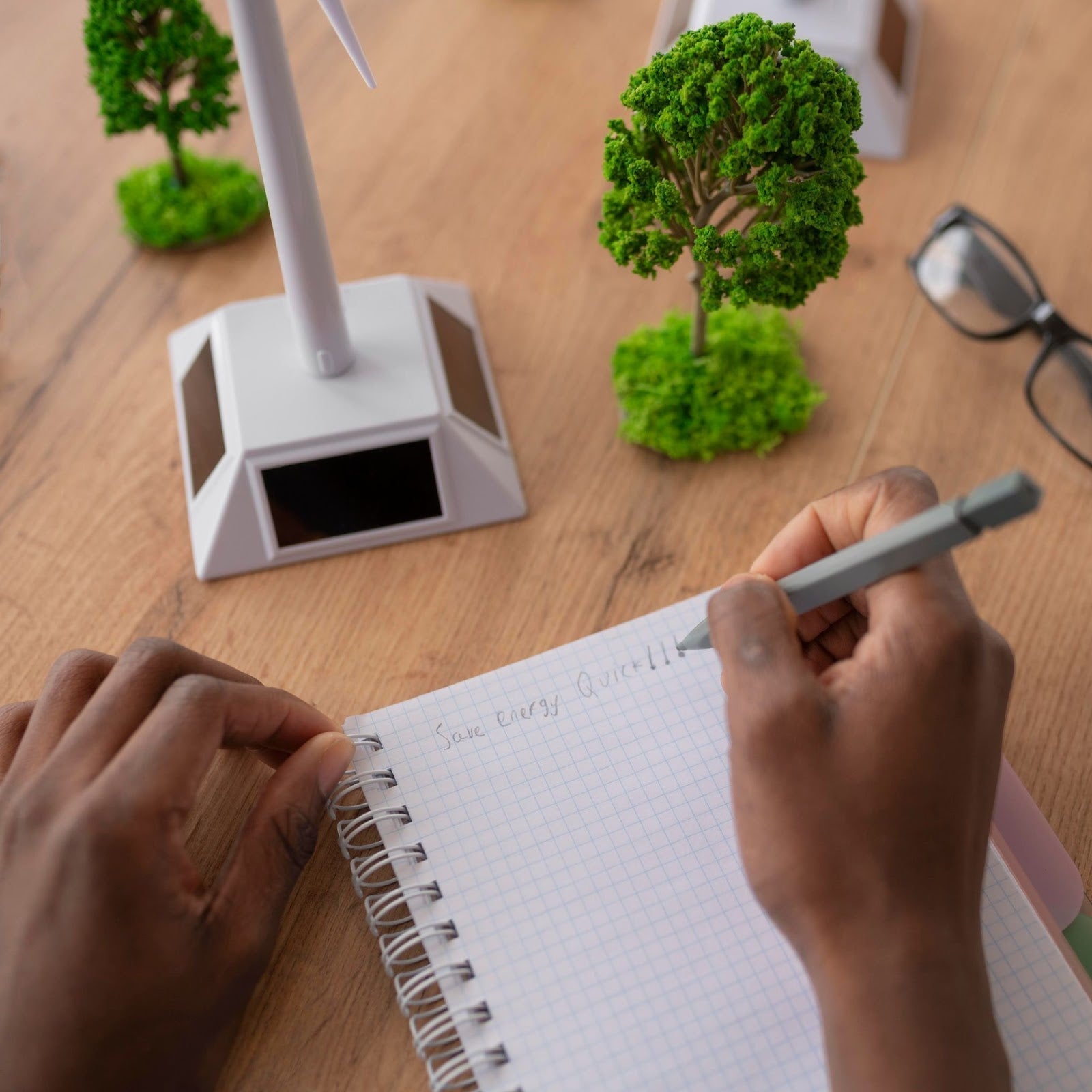 Illustration of carbon footprint impact with eco-friendly lifestyle choices like recycled notebooks