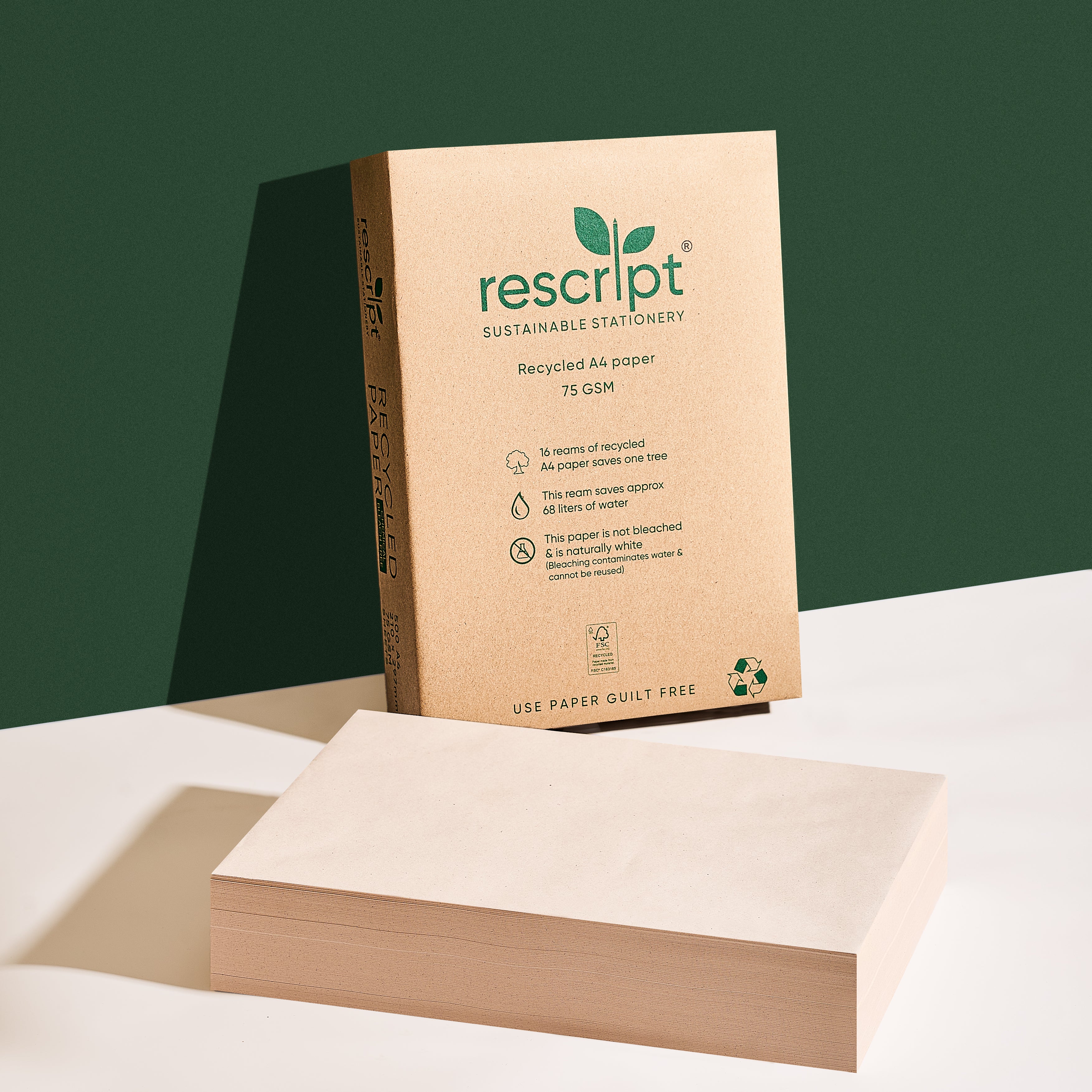 Recycled paper with Rescript packaging on a green background